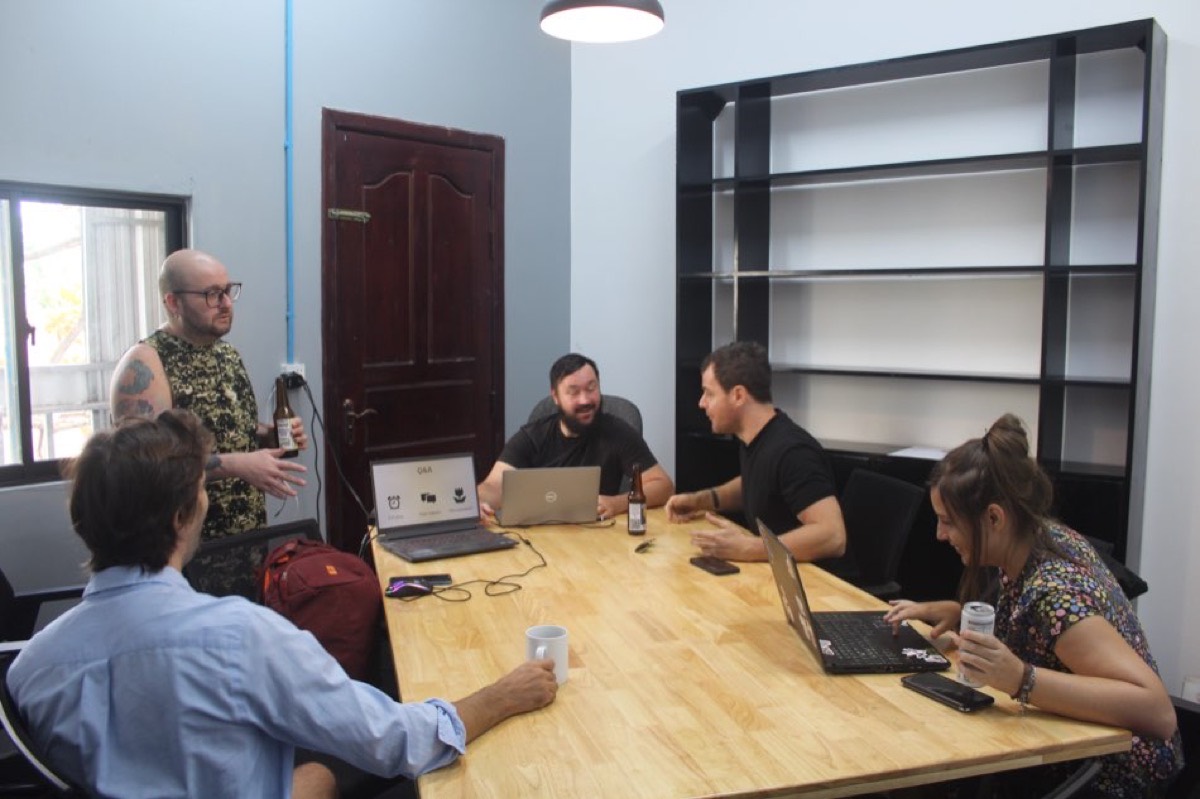 People working on laptops in the Level Up private room